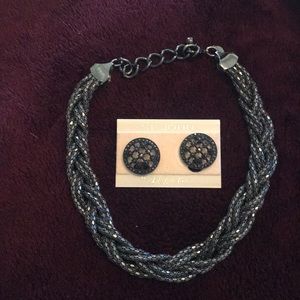 Black strand twist necklace.